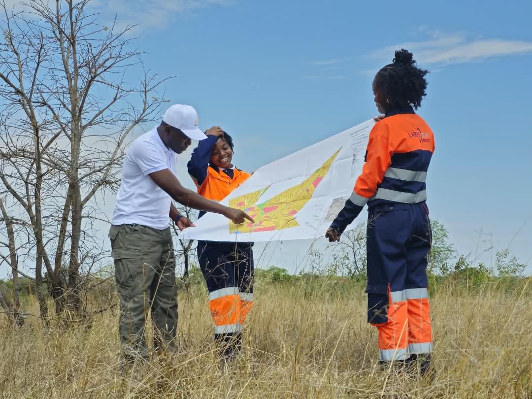The Champs team reviewing a site plan together on a client's stand