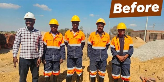 The Champs Construction team in hard hats and safety overalls on a cleared stand