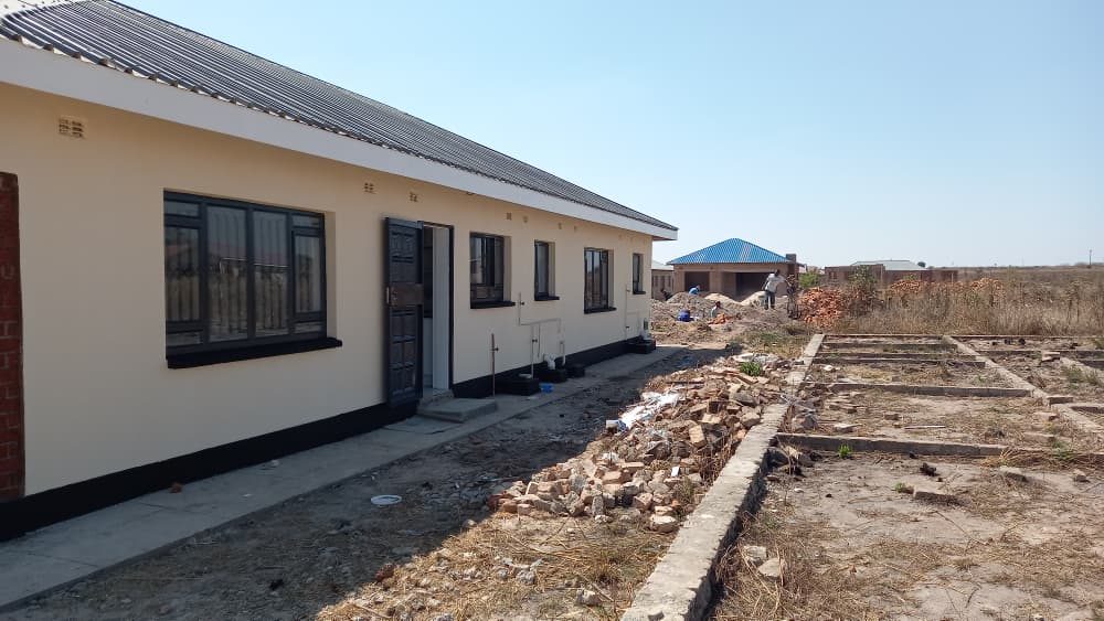 The rear entrance and paving
