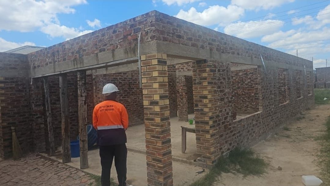 Before: the face-brick walls at wall plate