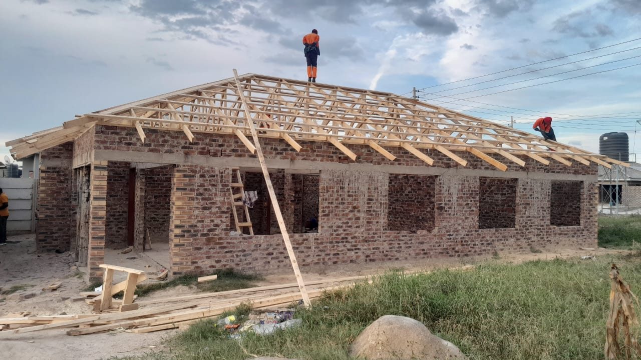 The timber trusses going up on the wall plate