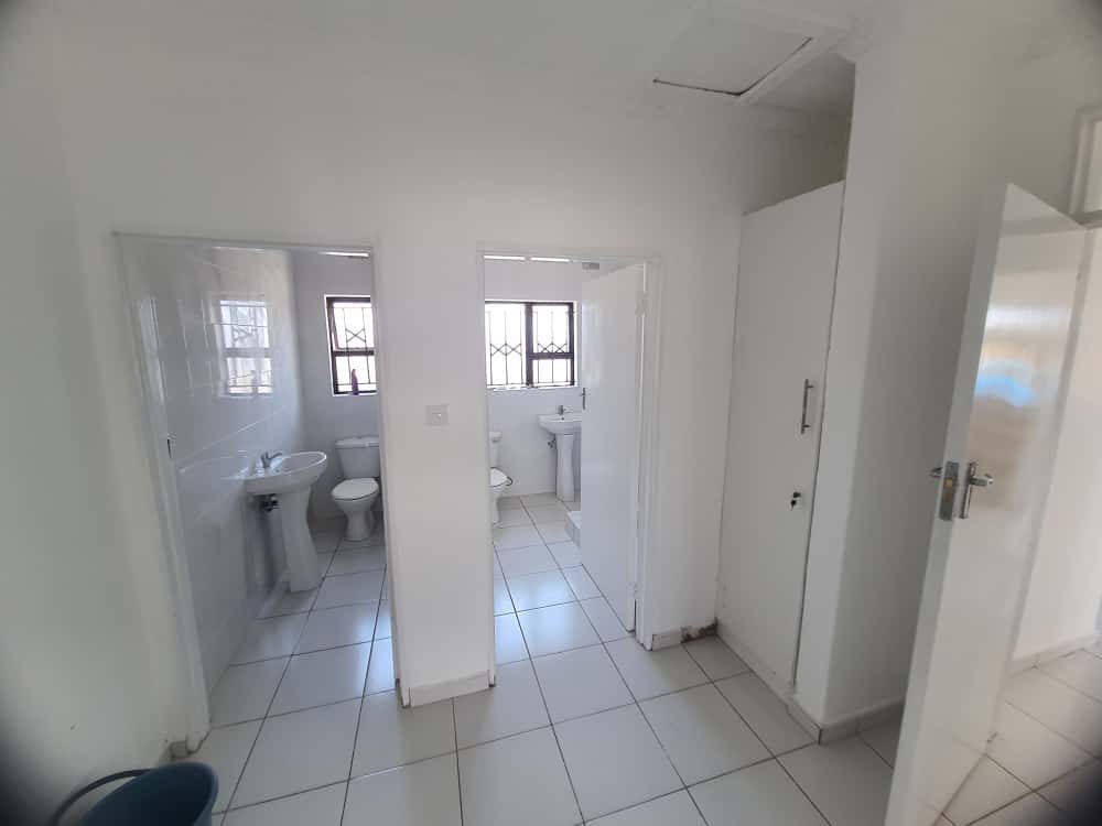 Tiled bathroom and separate toilet