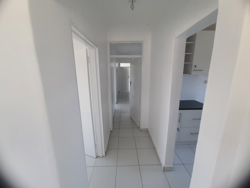 The tiled passage to the bedrooms