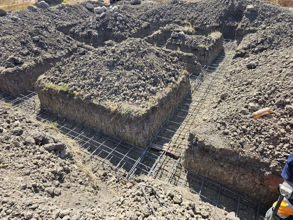 Steel reinforcement laid in the foundation trenches