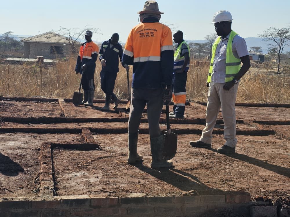 The Champs team setting out foundation trenches on a cleared stand